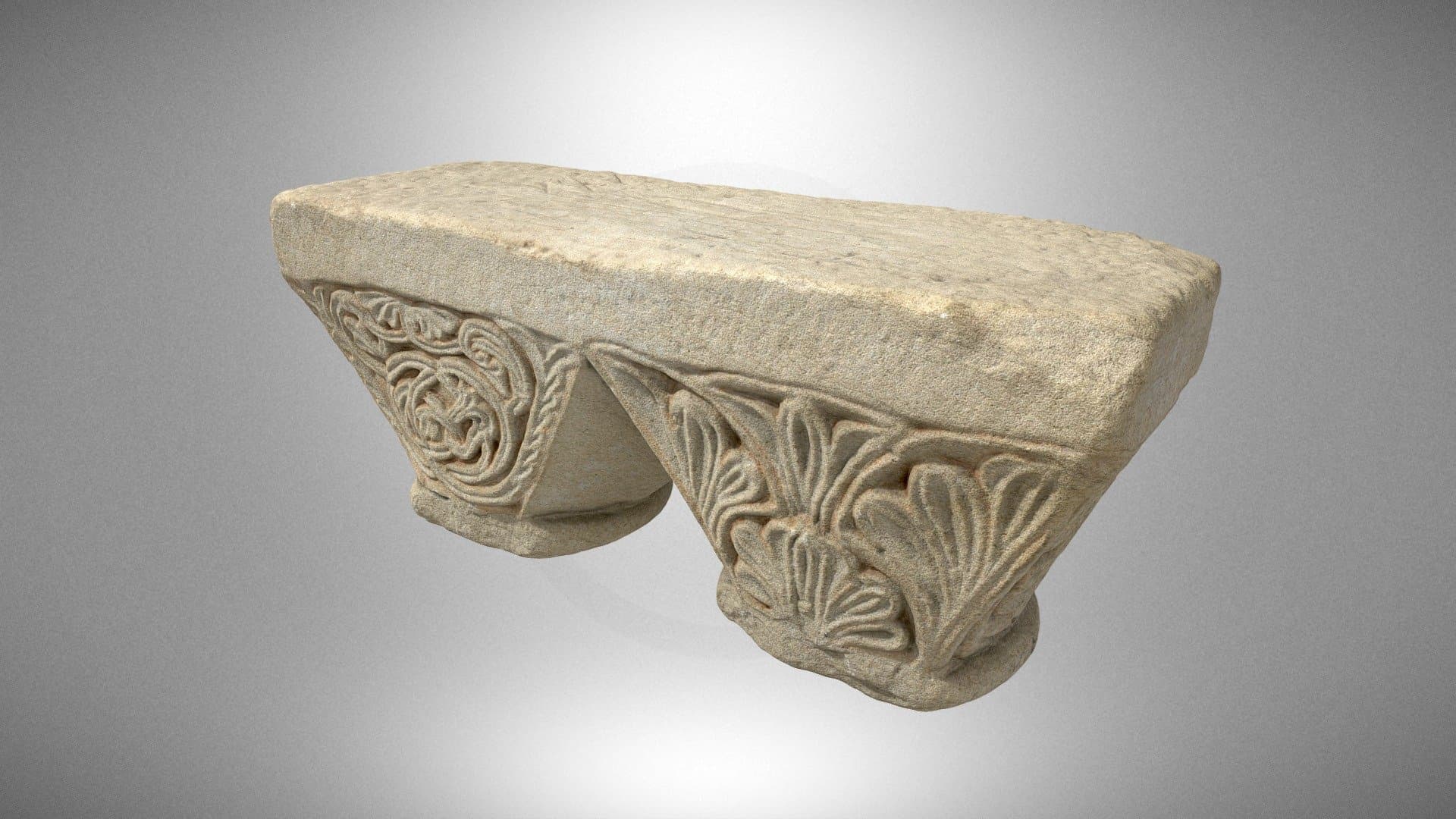 A twin capital with decoration of plant motifs