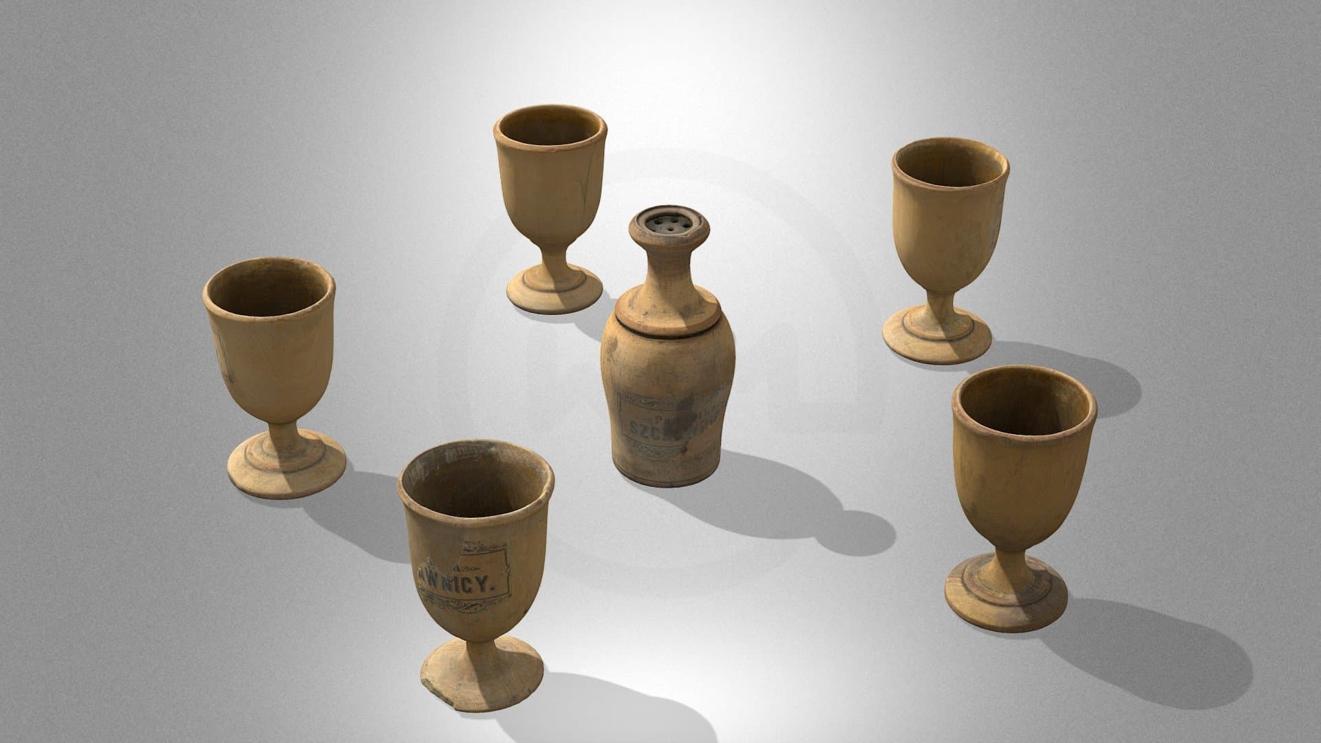 A set of egg cups with a salt cellar
