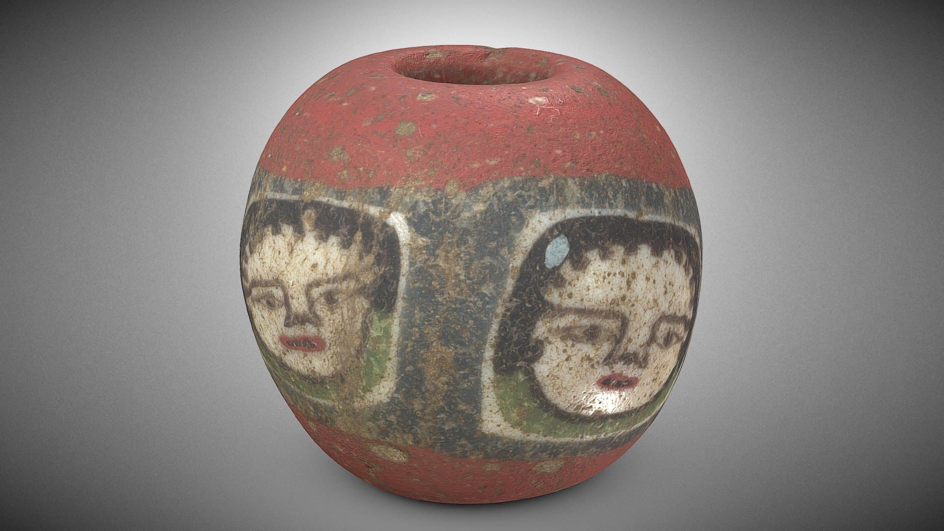 Glass bead with faces