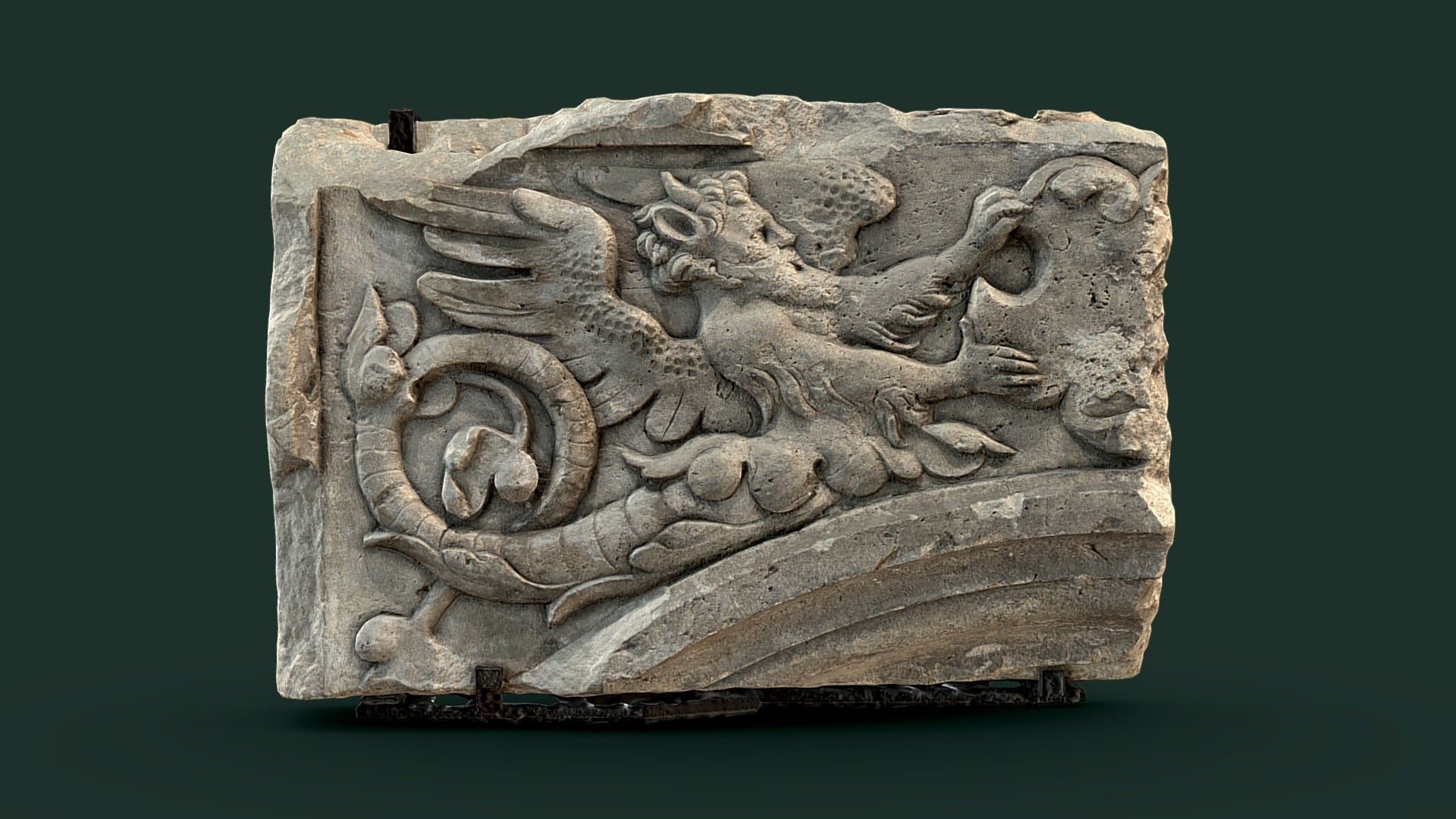 Relief with male figure and bearded face