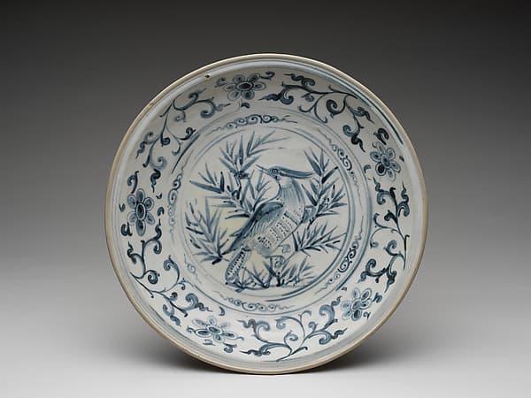 Dish with bird amid bamboo design and foliate meander on cavetto