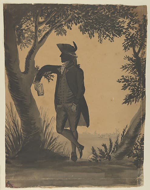Young Man Leaning Against a Tree With a Book