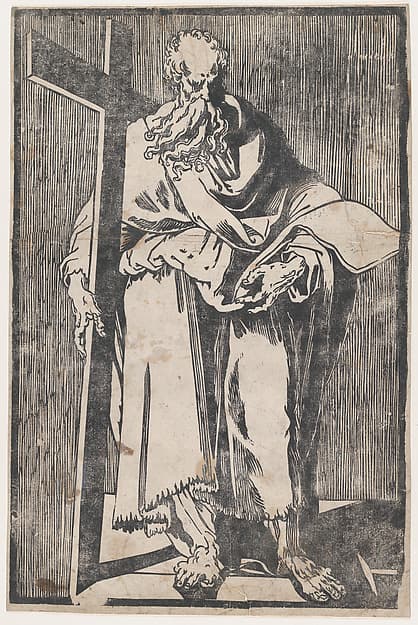 Saint Philip standing holding a book and a cross