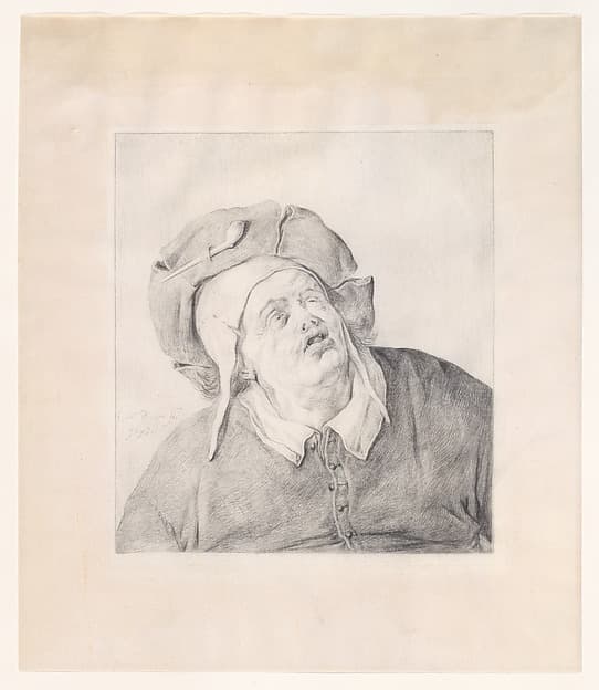 A man in a hat looking up