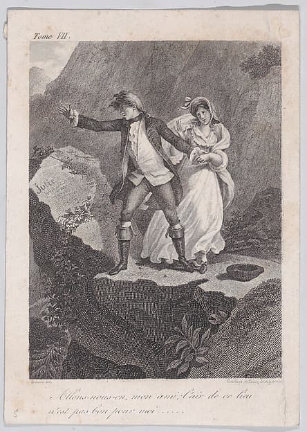 A couple standing on a mountain
