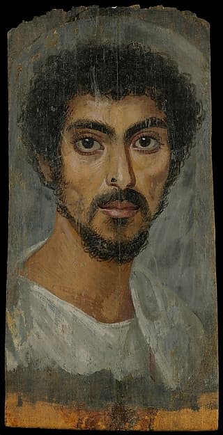 Portrait of a man with a mole on his nose