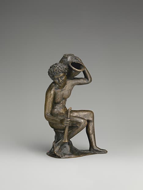 Seated youth with a lamp in the form of a snail shell