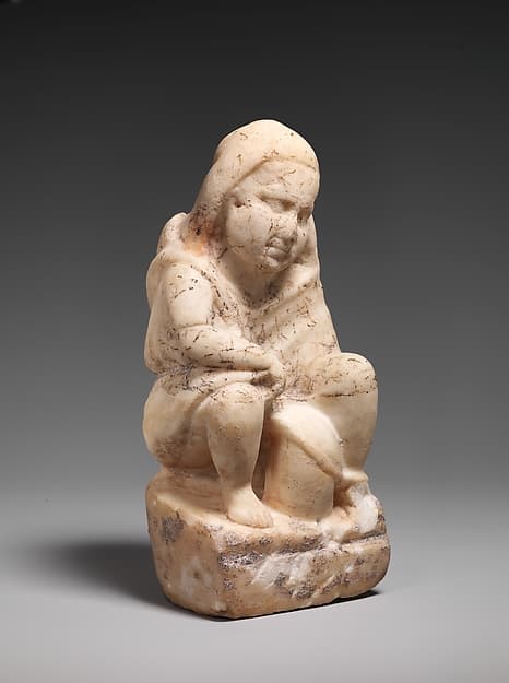 Marble statuette of a slave boy with a lantern
