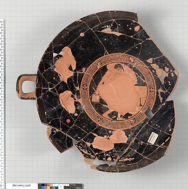 Terracotta fragment of a kylix (drinking cup)