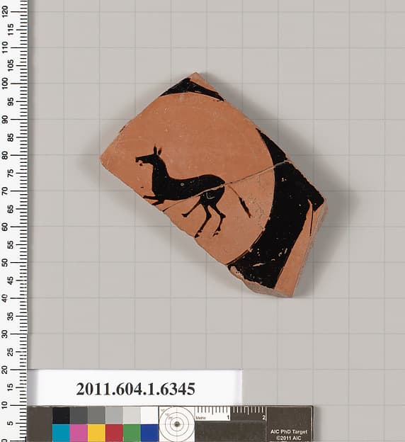 Terracotta fragment of a kylix (drinking cup)