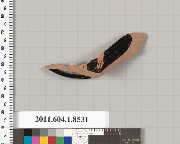 Terracotta fragment of a stemless kylix (drinking cup)