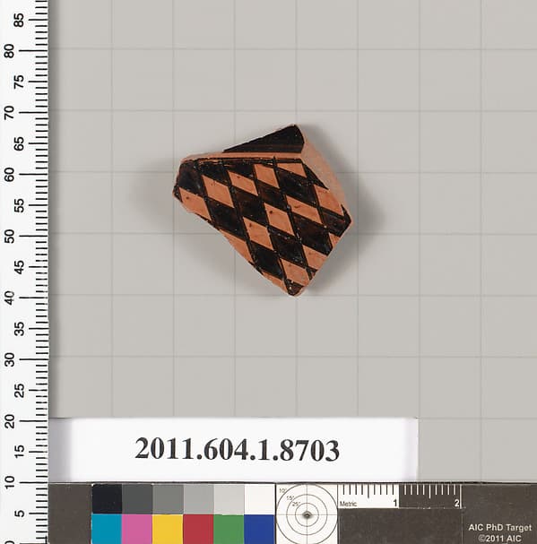 Terracotta fragment of a stemless kylix (drinking cup)