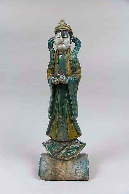 Roof tile with a standing figure