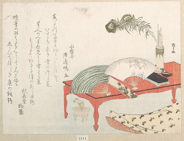 Red Table with Fans and a Brush Stand