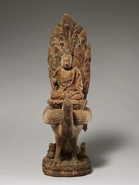 明早期 彩繪木雕阿彌陀佛乘孔雀像|Buddha, possibly Amitabha, on a peacock