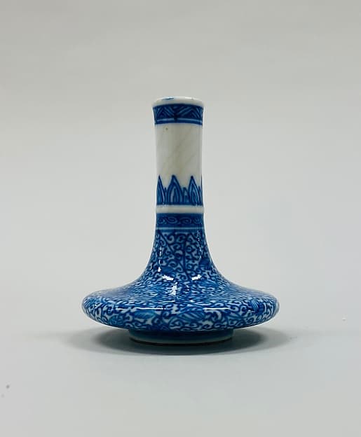 Minature vase with floral scrolls
