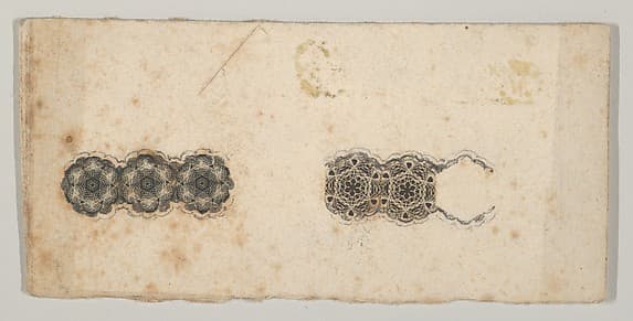 Banknote motif: two bands of ornamental lathe work resembling florets and hexagons