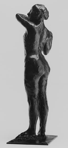 Dancer Adjusting the Shoulder Strap of Her Bodice