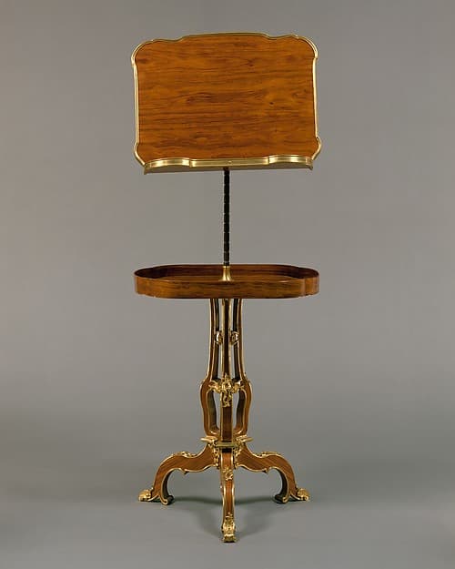 Adjustable reading and writing table (pupitre à crémaillère, servant de table)